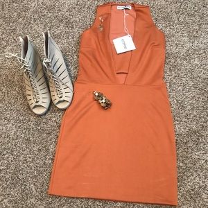 Kittenish cocktail dress with cut out tummy area